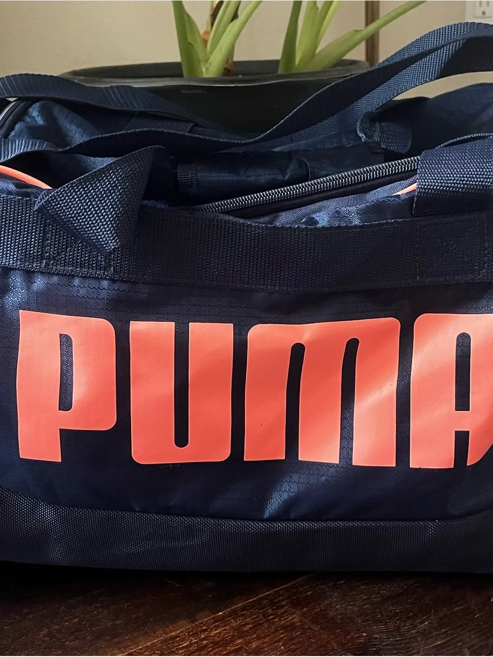 Puma Navy Duffel Bag with Coral Logo Accents